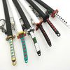 A collection of Demon Slayer mini katana replicas featuring various colored metal swords and decorative hilts.