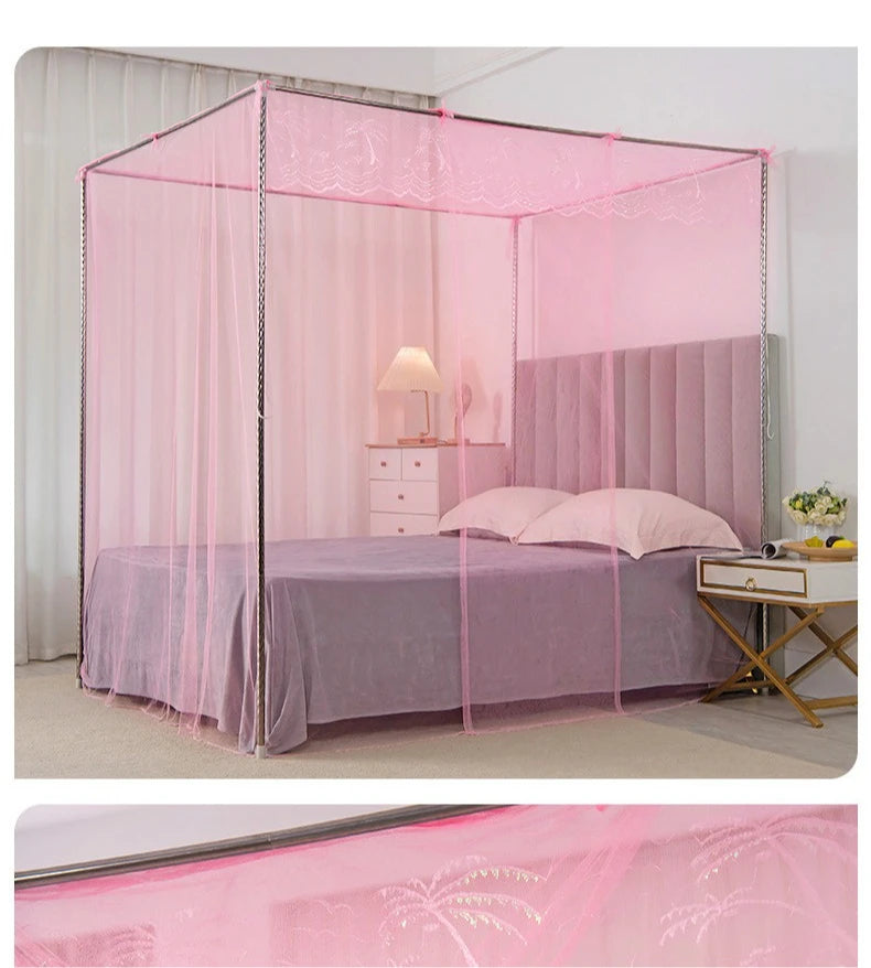 A pink lace canopy mosquito net draped over a bed with purple bedding and a bedside table.