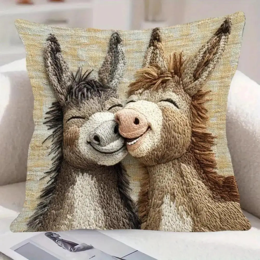 A realistic depiction of two donkey heads in a close embrace on a linen-cotton cushion cover.