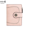 A light pink women's wallet with multiple card slots and RFID protection features.