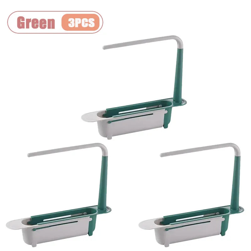 Three green adjustable over-sink dish drying racks or kitchen organizers.