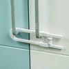 Close-up of a white cabinet lock mechanism with gray U-shaped handles and mounting plate.