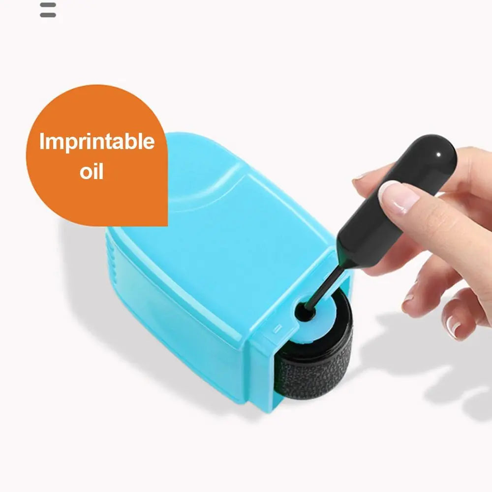 A hand is applying an imprintable oil stamp to a blue plastic device for identity protection.