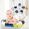 A high contrast tummy time pillow with various sea creatures is shown for a baby.