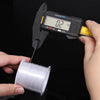 A hand holds a white nylon beading cord while measuring its thickness with a digital caliper tool.