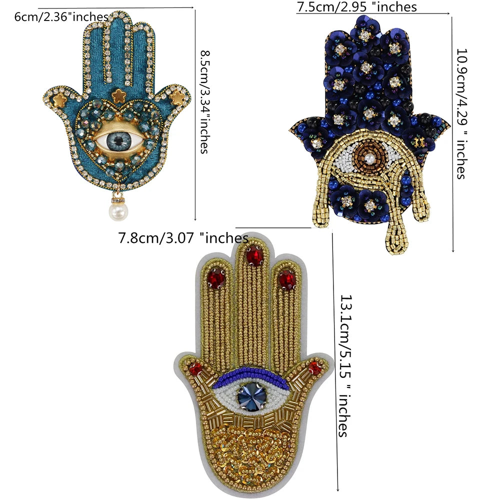Three handprint designs made of blue and gold beads and rhinestones for clothing and crafts