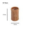 A cylindrical handwoven wicker serving basket with a lid, made of natural brown material.