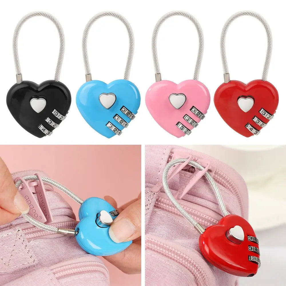 Red heart-shaped padlock with a combination dial and silver chain attached to a pink fabric.