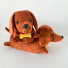 A brown plush toy dog with long floppy ears and a black nose is shown against a white background.