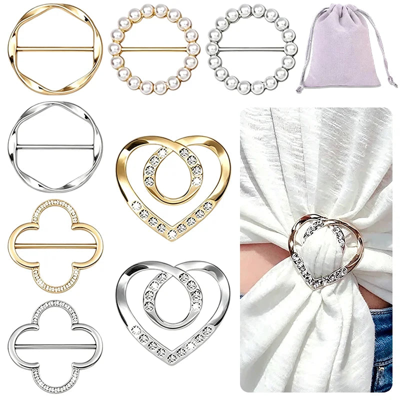 A collection of gold and silver metal rings and clips designed for fastening shirts and scarves.