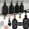 A collection of black and white refillable bottles for hair, body, and shower products including shampoo conditioner and body
