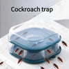 A clear plastic reusable cockroach trap with multiple compartments and trapped insects on a white surface.