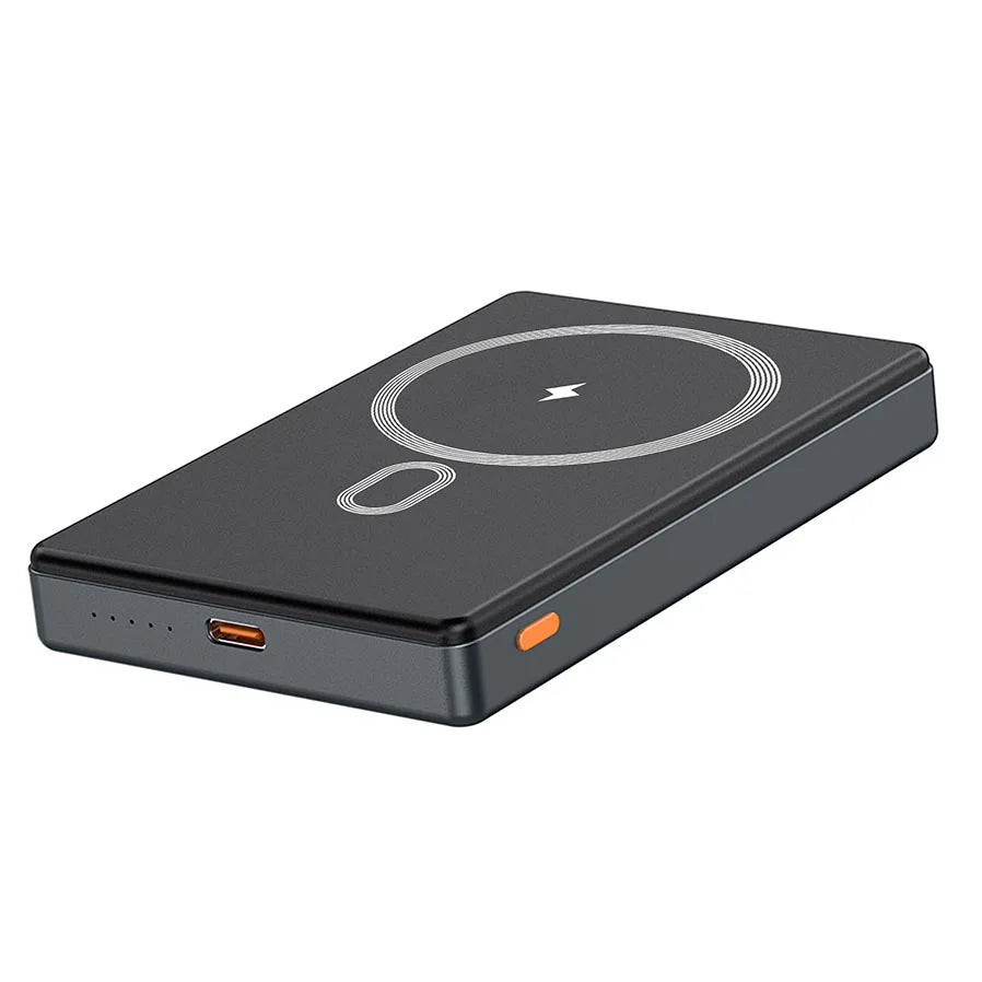 A black foldable magnetic wireless power bank with built-in cables shown from above.