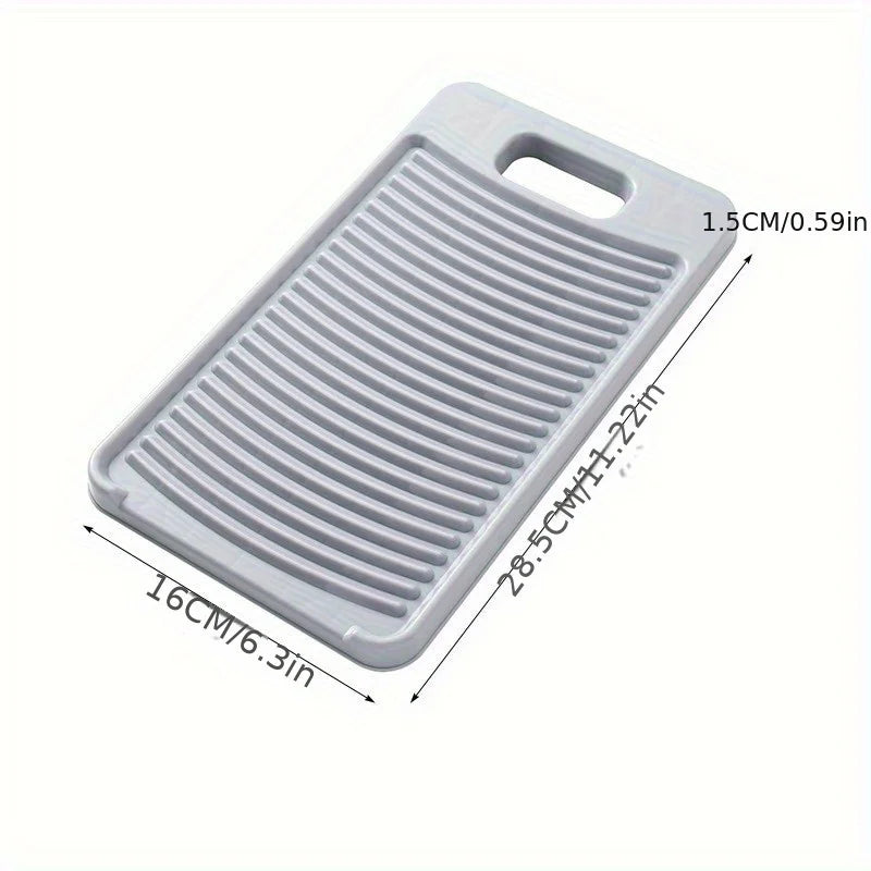 A white non-slip laundry scrubbing board with ribbed surface and handles.