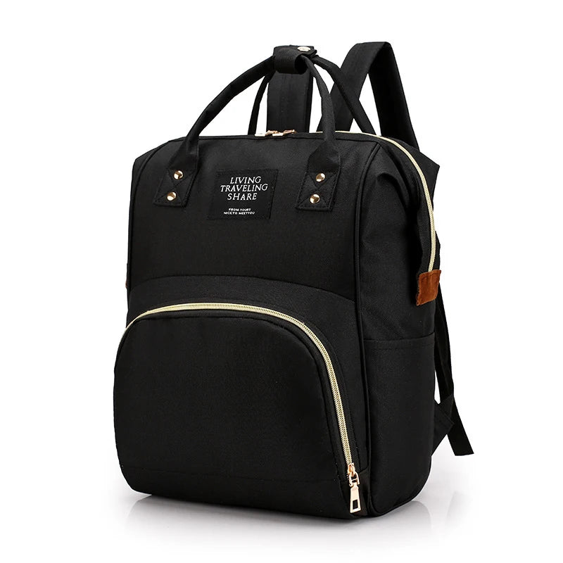 Black insulated canvas mummy diaper bag with a hanging hook and zippered compartment.