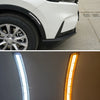 Close-up display of LED daytime running lights and dynamic turn signal assemblies for a Honda CR-V.