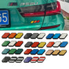A collection of 3D tri-color grille emblem stickers in various colors and designs for Toyota trucks and SUVs.