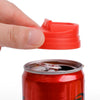 A hand is holding a red reusable leakproof can cover, positioned above a red soda can.