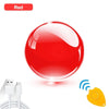 A shiny red spherical toy with an attached antenna and a yellow key fob.