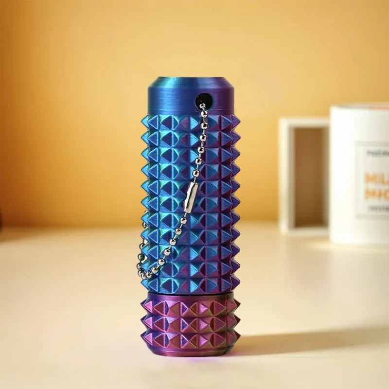 A vibrant blue and purple spiky fidget keychain is displayed on a white surface.