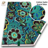 Cotton Satin Grand Wax fabric featuring a vibrant teal and black floral pattern.