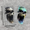A realistic vinyl skull decal featuring glowing eyes and detailed bone structure, shown against a gray textured background.
