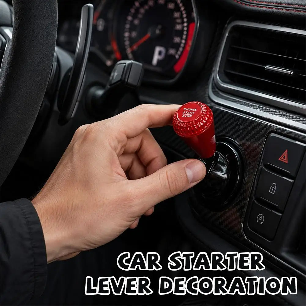 A hand is operating a red car starter lever decoration on a vehicle dashboard.