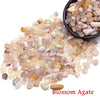 A pile of Blossom Agate crystal stone chips in various translucent and milky colors.
