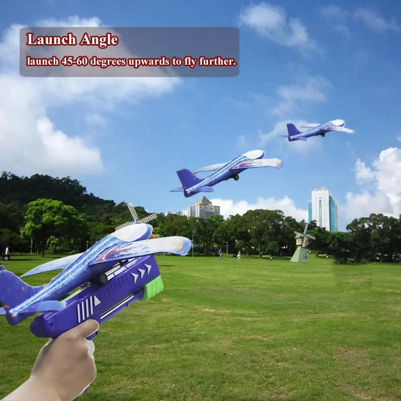 A hand launches a purple and blue foam plane toy upwards, demonstrating the launch angle for flight.