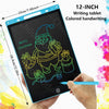 A hand holds a 12-inch colored handwriting tablet displaying a Christmas elf drawing.