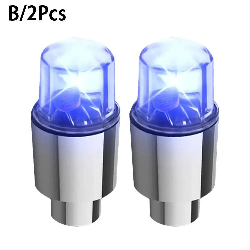 A pair of motion-activated LED tire valve lights for bikes, cars, or motorcycles.