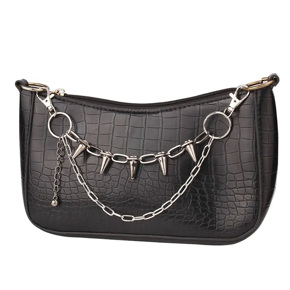 Black crocodile print handbag with a gold metal chain strap