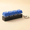 A black LED mechanical keychain fidget toy with blue custom keycaps and a metal keyring.