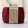 A ball of deep red bamboo fiber yarn for knitting and crochet