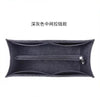 A dark gray felt bag organizer insert featuring a zippered pocket.