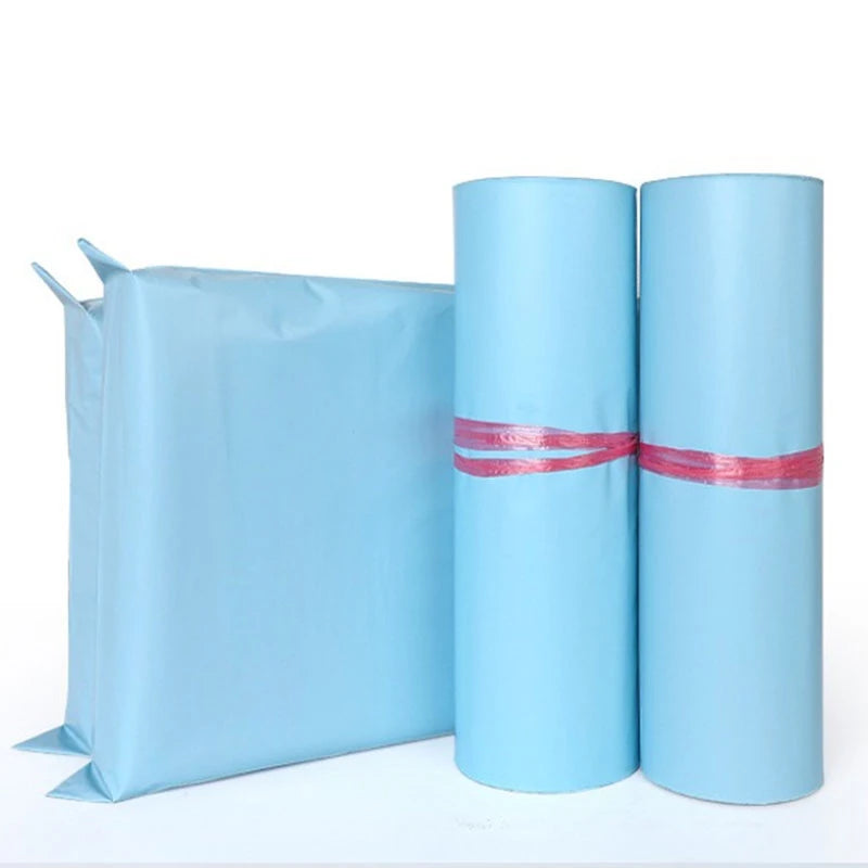 Three rolled blue heavy-duty waterproof poly mailer bags for shipping and storage