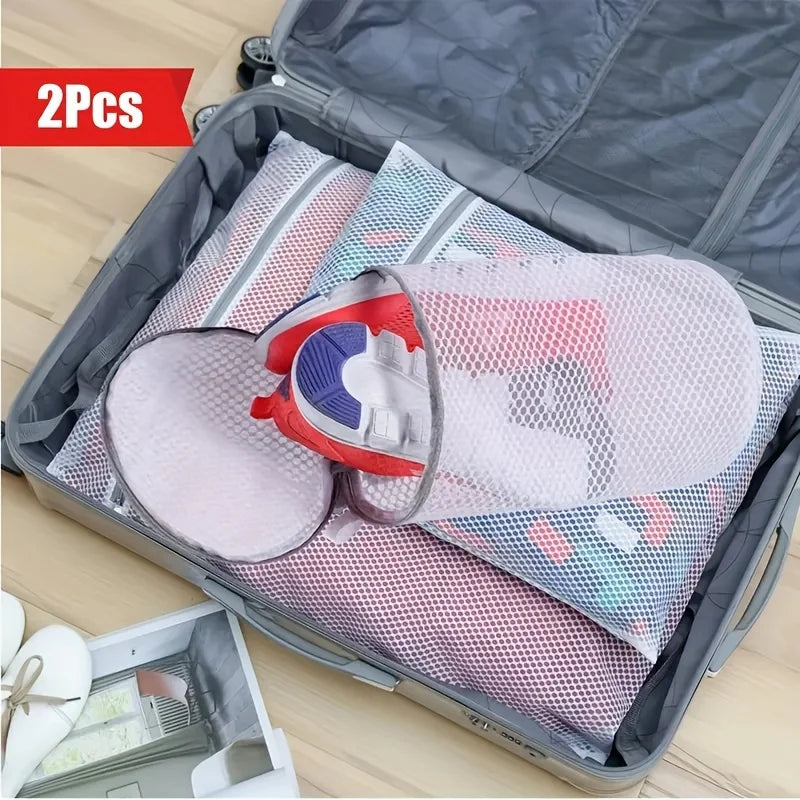 Two reusable mesh laundry bags for shoes and delicates are shown inside a gray storage box.