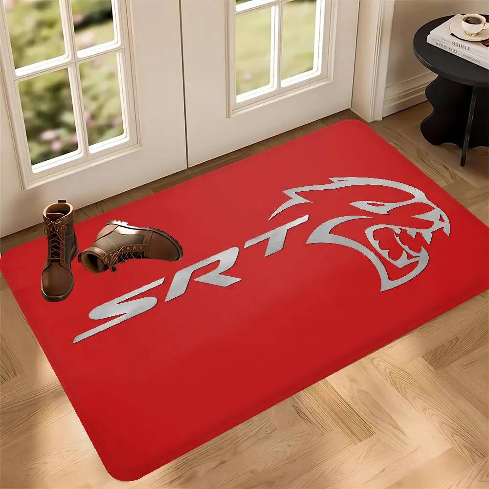 A red anti-slip doormat featuring a silver stylized lion head design on a wooden floor.