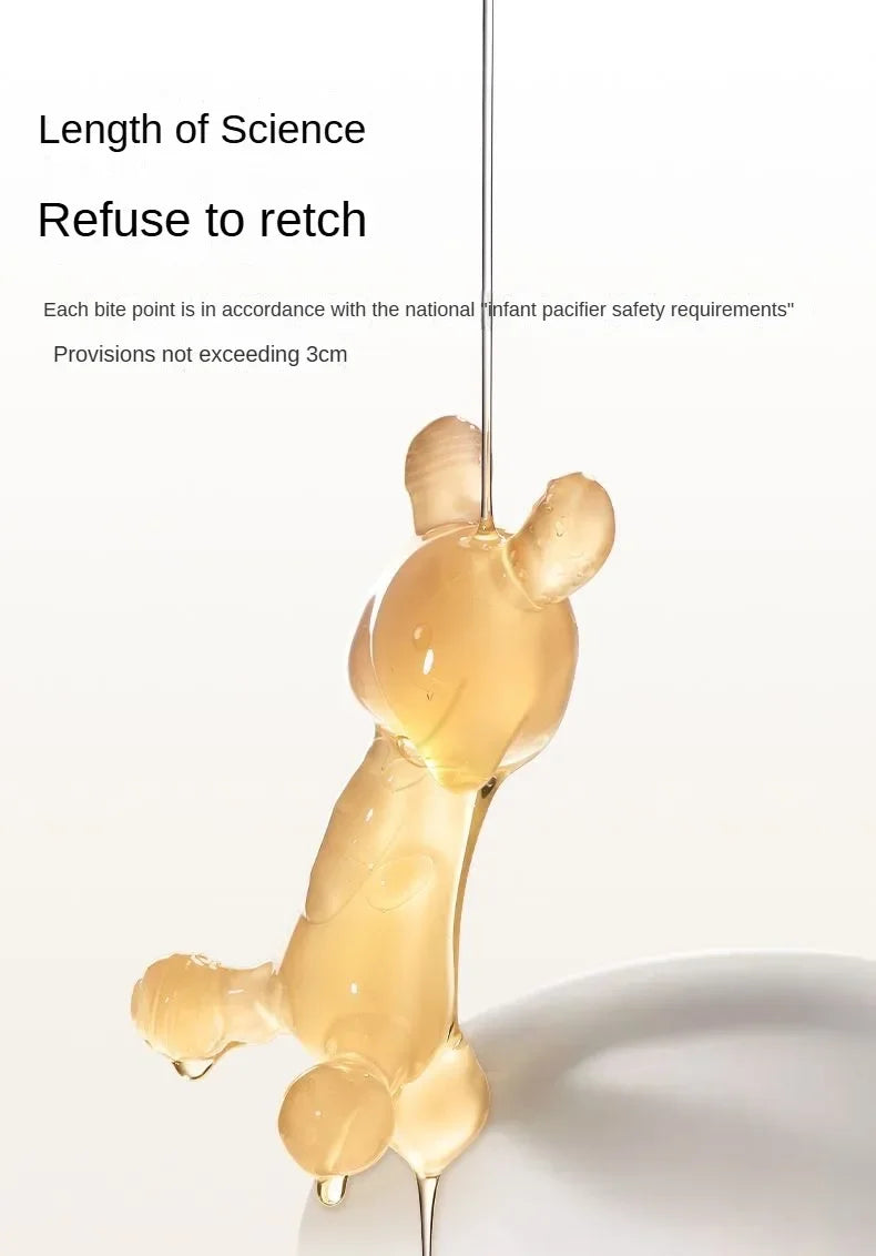 A silicone cartoon rabbit teether in a pale yellow color is shown against a white background.