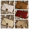 A set of linen texture retro envelopes in beige and red with gold sealing wax stickers displayed on draped fabric.