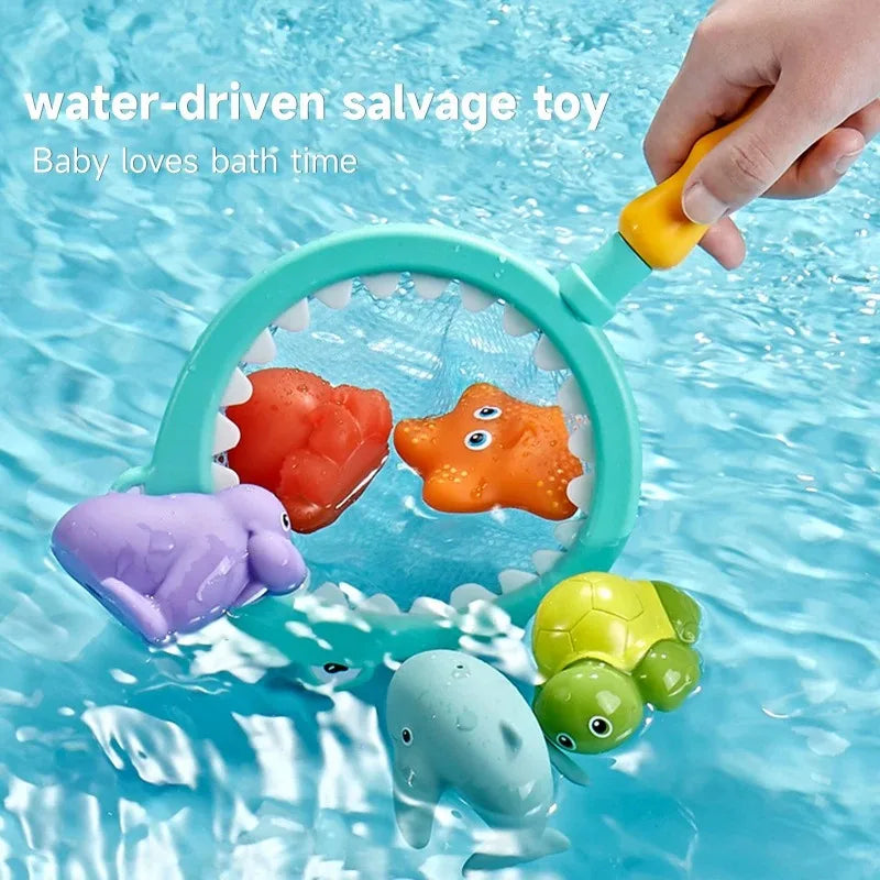 A hand holds a water-driven salvage toy featuring a catch net with orange and purple sea creatures floating in blue water.
