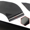 A close-up view of a black carbon fiber door handle protector film applied to a car door surface.