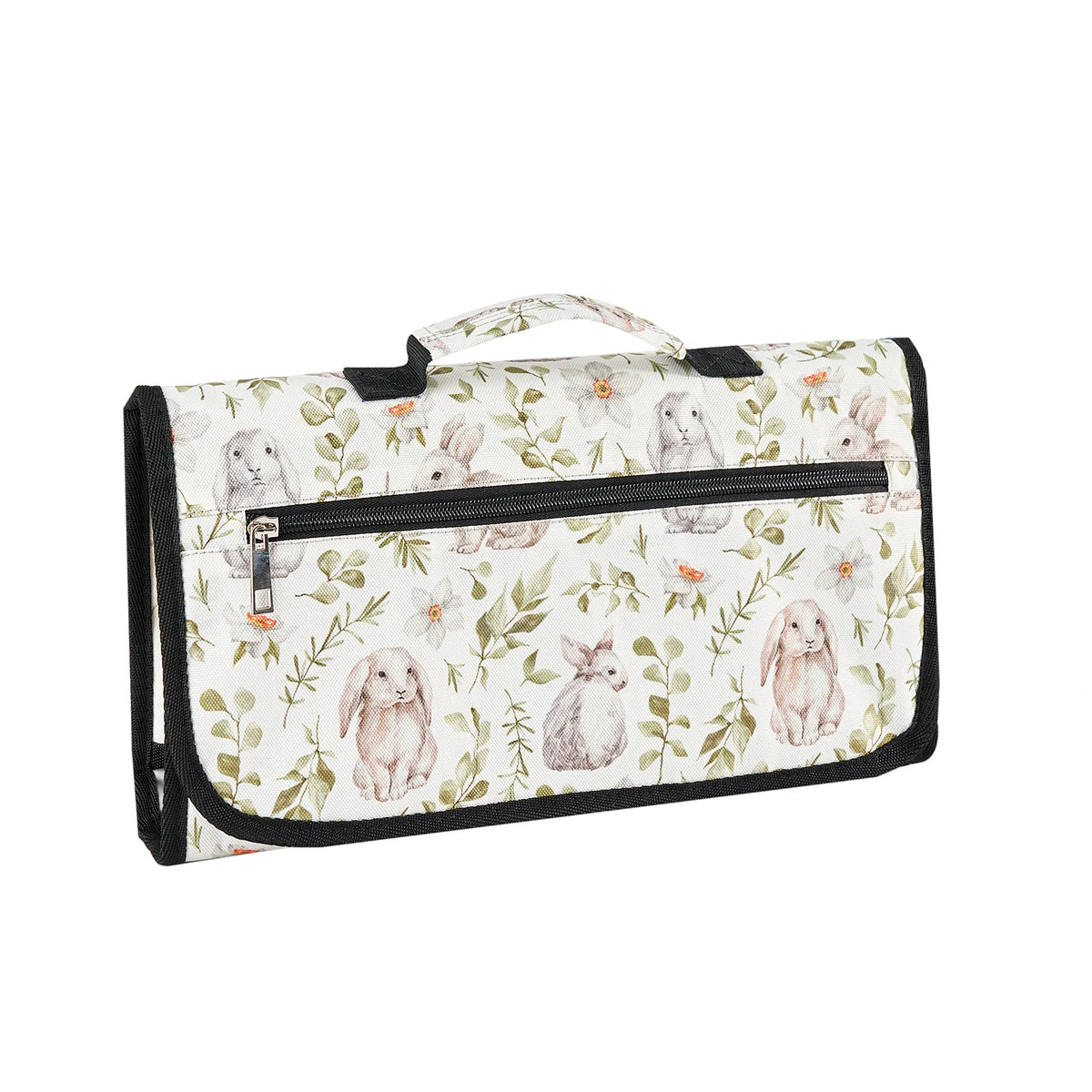 A foldable waterproof baby changing pad with a light floral pattern and a black handle.