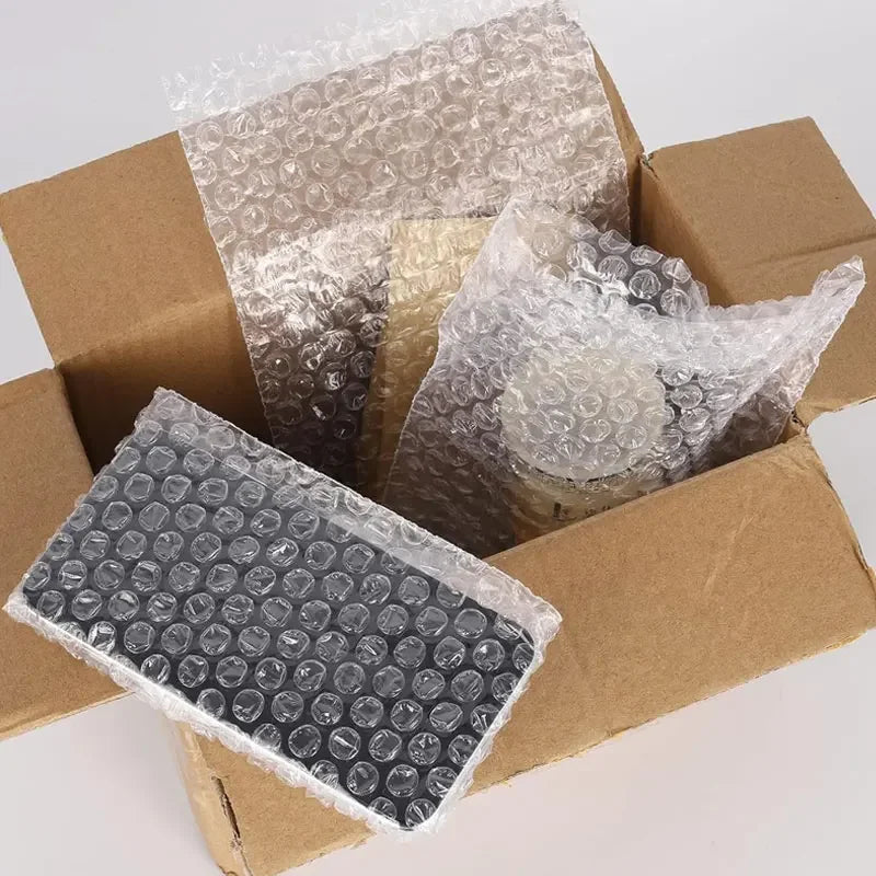 Clear bubble mailers with cushioned protection packaged in brown cardboard boxes.