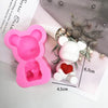 Pink silicone mold shaped like a bear for crafting candles, soap, and resin
