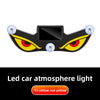 A black demon eye window decal with yellow and red glowing eyes, used as a led car atmosphere light.
