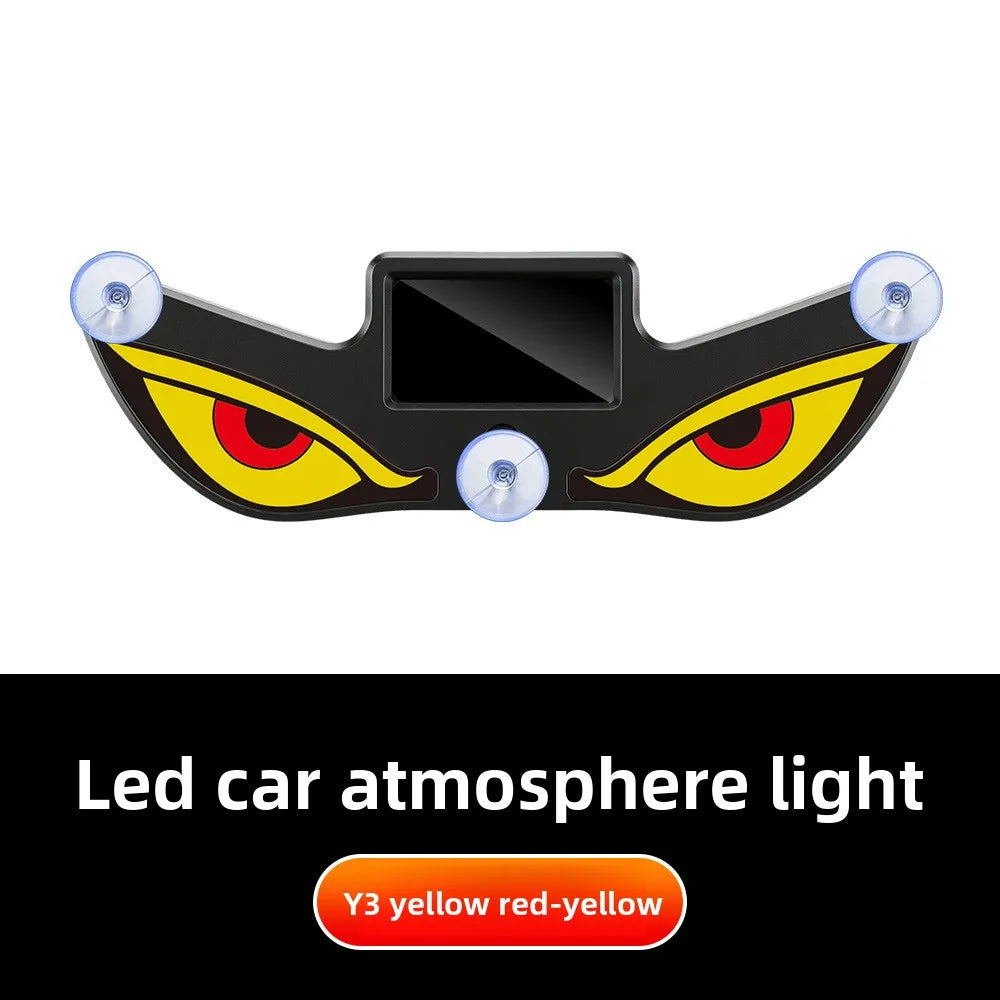 A black demon eye window decal with yellow and red glowing eyes, used as a led car atmosphere light.