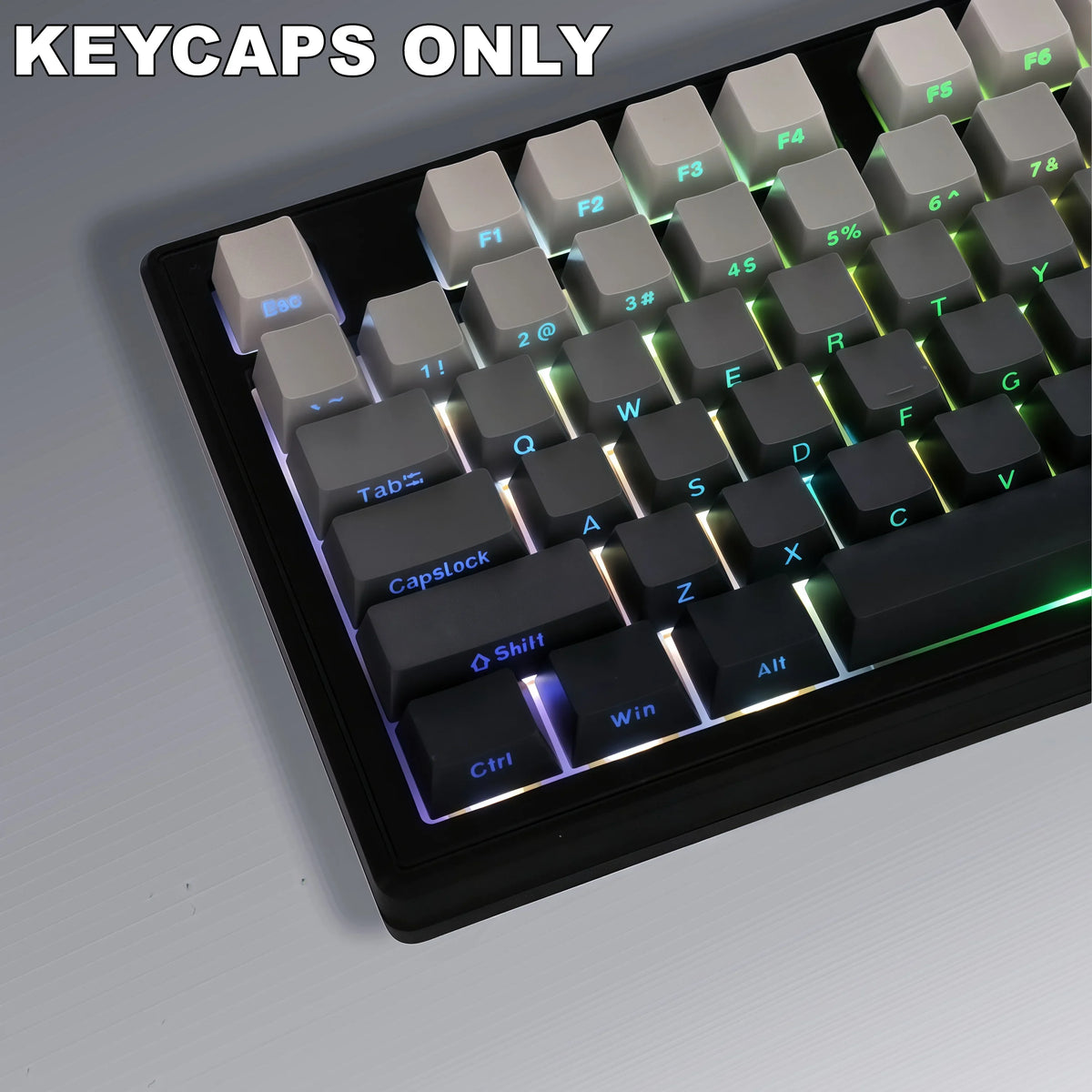 A close-up view of a black mechanical keyboard featuring a set of light gray keycaps with gradient colors.