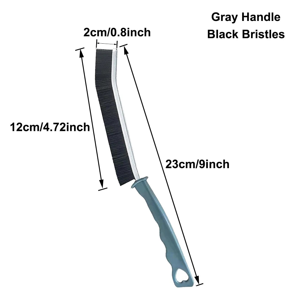 A long, narrow cleaning brush with a gray handle and black bristles for tight spaces.