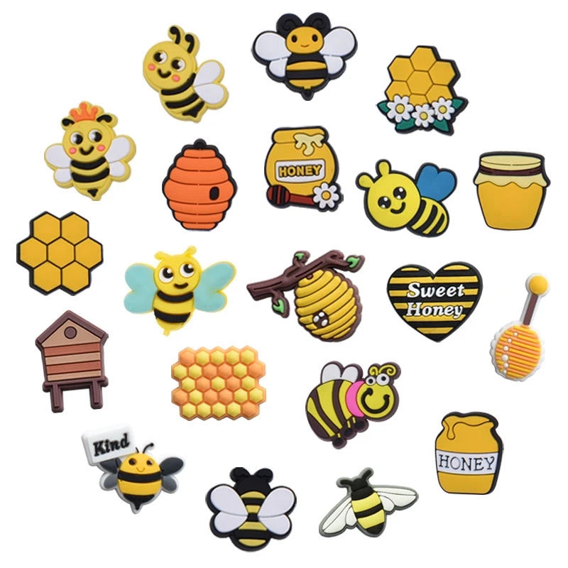 A set of yellow and black bee-themed PVC pins and charms for decorating shoes and accessories.